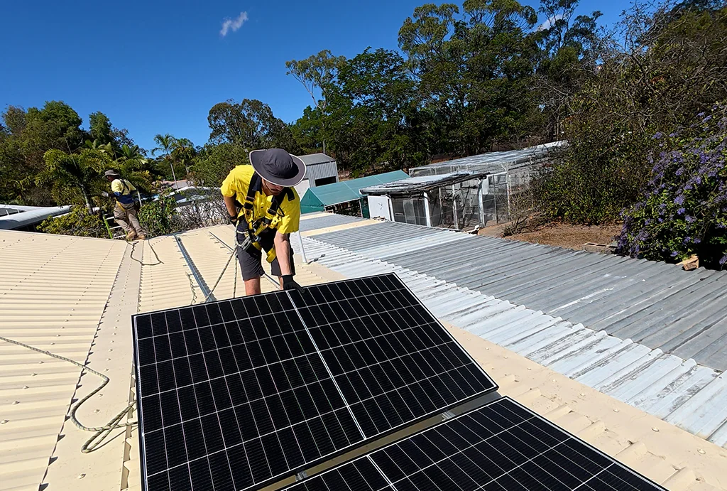 true-north-solar-installer-holding-solar-panel residential solar system install
