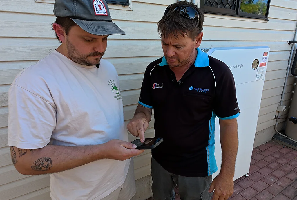 true-north-solar-installer-with-homeowner-at-handover