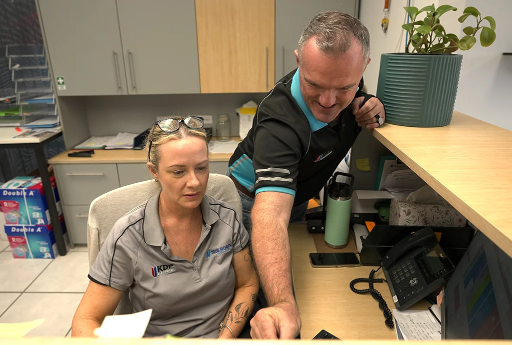 Kash from True North Solar with front desk staff